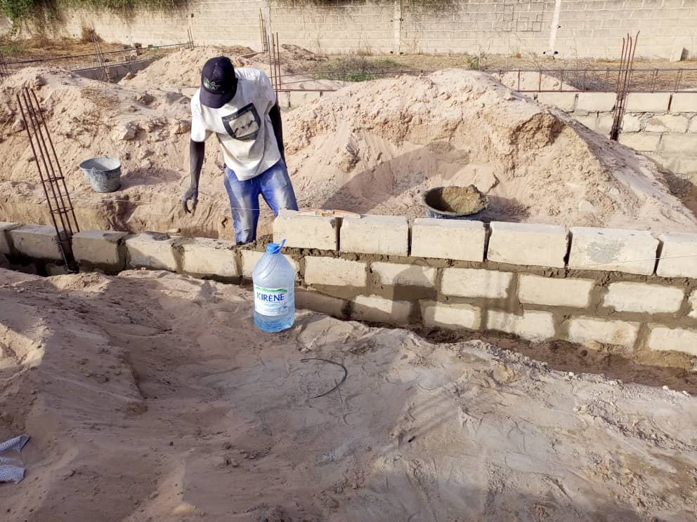 Children visiting QSV Senegal office during Idul Fitr celebrations receiving sweet treats!